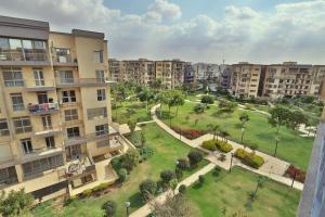 an aerial view of a park in a city at A very, very special residential unit in Madinaty