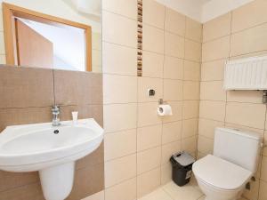 a bathroom with a sink and a toilet at Pokoje Noclegowe Sierpów in Sierpów
