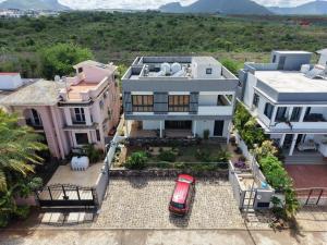 an aerial view of a house with a red car at J'Vais Residence in Flic-en-Flac