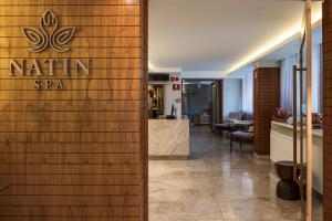 a lobby of a spa with a sign on a wall at Hotel da Bahia by Wish in Salvador +58 photos