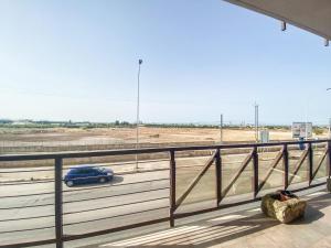 a blue car driving on a highway at Blue Room - Camera Matrimoniale con Garage Privato in Bitonto +3 photos