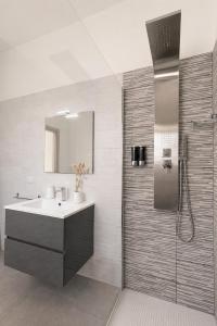 a bathroom with a sink and a shower at RestHouse The Village in Nardò +61 photos