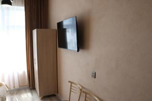 a flat screen tv on the corner of a wall at Miva in Qusar +20 photos