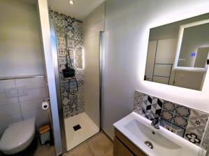 a bathroom with a shower and a toilet and a sink at La Pause Jardaise in Jard-sur-Mer +11 photos
