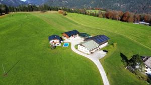 an aerial view of a house in a field at Ferienwohnung Kollerlehen in Bischofswiesen