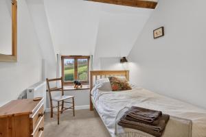 a bedroom with a bed and a desk and a chair at 2 Bed in Taunton oc-conco in West Monkton