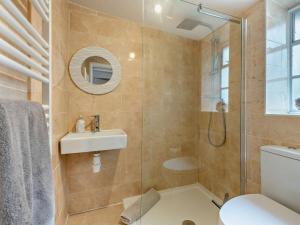 a bathroom with a shower and a sink and a toilet at 3 Bed in Swanage oc-ic098 in Swanage +13 photos