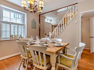 a dining room with a table and chairs at 3 Bed in Swanage oc-ic098 in Swanage