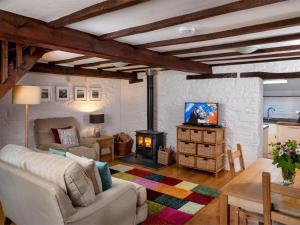 a living room with a couch and a fireplace at 1 Bed in Brecon oc-bn336 in Talgarth
