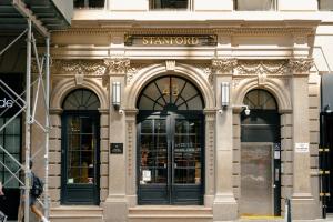 a store front of a building with the words stanford at Hotel Stanford in New York