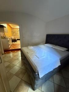 a bedroom with a large bed in a room at Casa Di Porto in Kotor