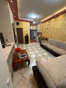 a living room with a couch and a coffee table at Casa Di Porto in Kotor