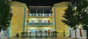 a large building with lights on the front of it at Arun Lodge and Cottage Near Thiruchendur in Korkai