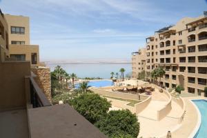a view of a swimming pool from a building at Apartment at Samarah Resort DeadSea C13-Families & couples only in Sowayma