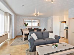 a living room with a couch and a table at Ringlaan 70 2V0201 in Wenduine