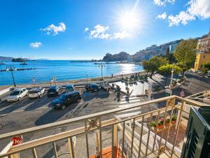 a view of a city with cars parked in a parking lot at Maridea - Spiaggia Sant' Antonio in Ponza