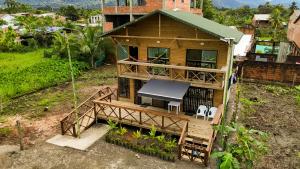 an overhead view of a house with a table and chairs at El Canto del Manglar in Nuquí