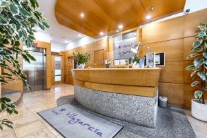 a lobby with a reception desk and a counter at Hotel Vilagarcia in Vilagarcia de Arousa