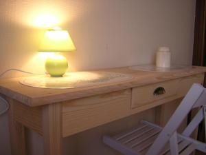 a table with a lamp on top of it at The Cosy Hill in Poperinge