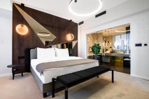 a bedroom with a large bed and a bathroom at Premium Hotel, Novi Sad in Novi Sad +160 photos