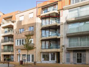 an apartment building with balconies on a street at Beaufort 0401 in Wenduine