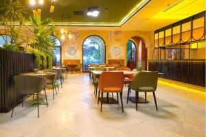 a dining room with tables and chairs in a restaurant at R2 Rio Calma in Costa Calma +47 photos