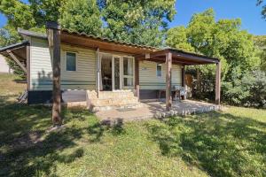 a small house with a porch and a porch at Mobilehome chez dede in Porto-Vecchio +15 photos