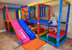 a young child playing in a play room at Hotel Cumuruxatiba in Cumuruxatiba