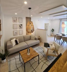 a living room with a couch and a table at Mirielle Apartments in Rust