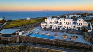 an aerial view of a villa with a swimming pool at Caldera's Memories in Imerovigli