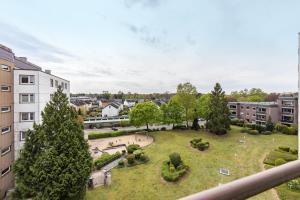 an aerial view of a park with trees and buildings at Panorama Suite Quickborn in Quickborn