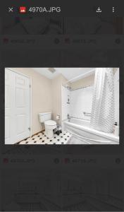 a picture of a bathroom with a toilet and a door at Spacious house 6 bedroom near ferry in Delta