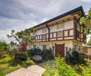 an exterior view of a house with a balcony at Nawa Wellness in Calatagan