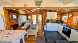 a kitchen and living room of a tiny house at Lunalodge in Trawsfynydd