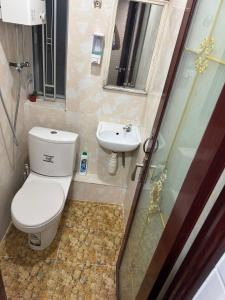 a bathroom with a toilet and a sink at Reliance Block C 12f in Hong Kong