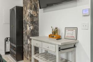 a white table in a room with a cabinet at Park Hotel Studio Suite 511 in Chattanooga