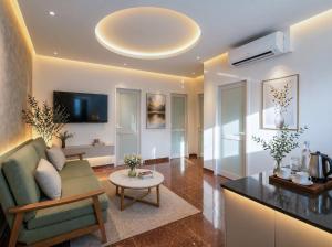 a living room with a couch and a table at Soléa Boutique Hotel & Spa By Sol in Ho Chi Minh City