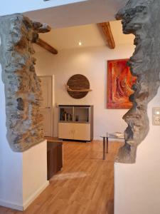 a living room with a stone wall at Ferienwohnung Lienz Egger in Lienz