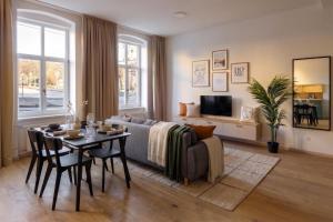 a living room with a table and a couch at Villa Šanca in Bratislava