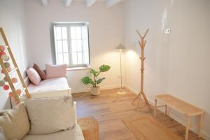 a living room with a couch and a window at Villa Casalís in Cubas