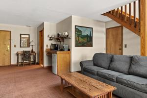 a living room with a couch and a table at Emerson Resort & Spa in Mount Tremper