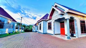 a group of houses on a brick street at Jk Suites Karatu in Karatu