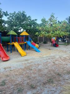 a group of playground equipment in a park at 18 El escape perfecto frente al mar in Santa Marta