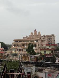a city with a large building in the background at LivShared in Patna