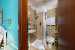 a bathroom with a toilet and a sink and a shower at Hotel Silvana Garnì in Limone sul Garda +51 photos