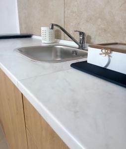 a white counter top with a sink in a bathroom at DOMUS Canonico in Noto +23 photos