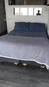 a large bed in a room with at Tinaja en la playa para 2 in Matanzas