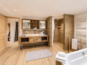 a bathroom with a sink and a shower at Ferienwohnung Resi´s Welfenoase in Schwangau +16 photos