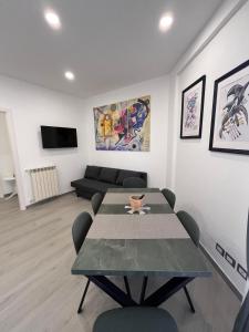 a living room with a table and a couch at Brothers house in Genzano di Roma