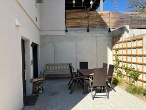 a patio with a table and chairs and a bench at Auszeit in Schwaigern in Schwaigern